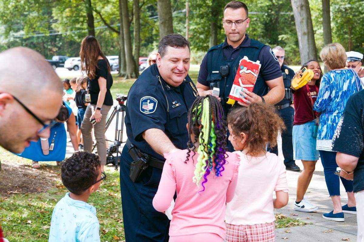 Liberty Police Chief Toby Meloro with kids
