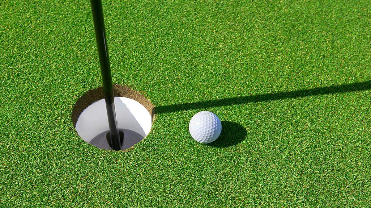 Golf ball on green