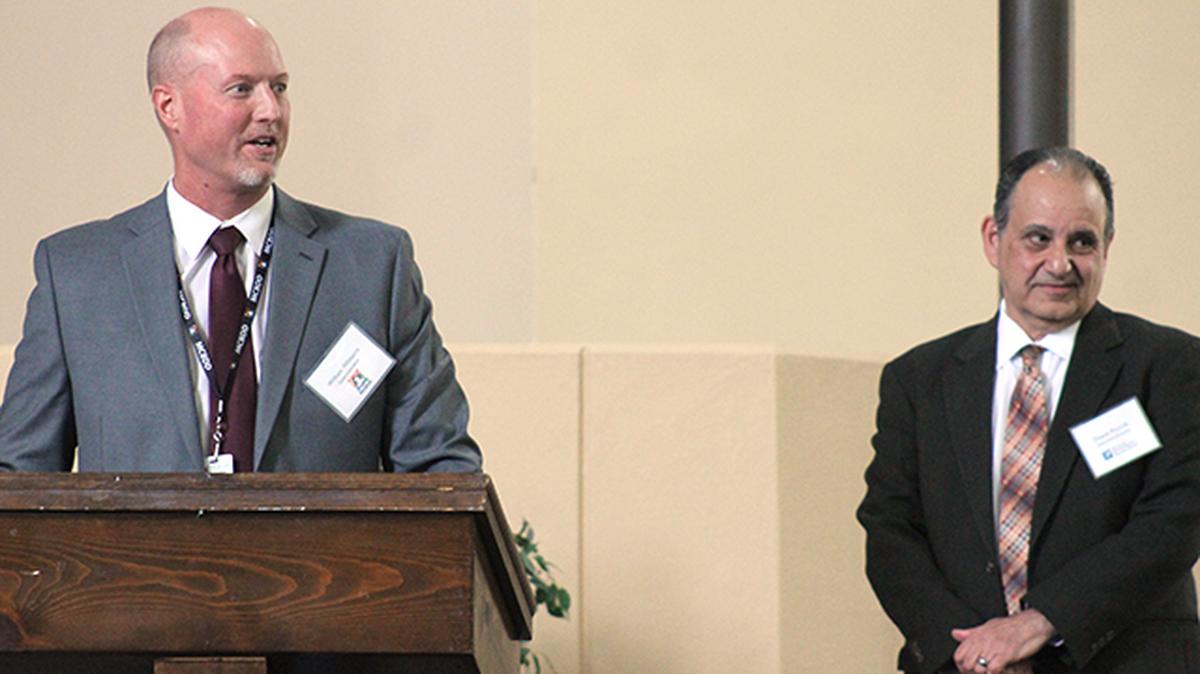 Mahoning County Board of Developmental Disabilities Superintendent Bill Whitacre (left) and Mahoning County Mental Health and Recovery Board Executive Director Duane Piccirilli address the Western Reserve Port Authority board of directors Wednesday, April 21, 2021, at the newly reopened Mahoning Valley Campus of Care in Mineral Ridge.