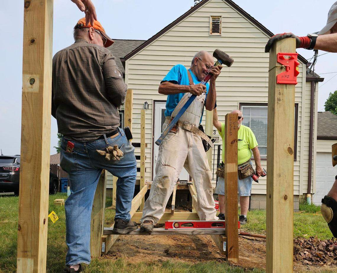 Habitat for Humanity volunteers rebuild ramp at Struthers home