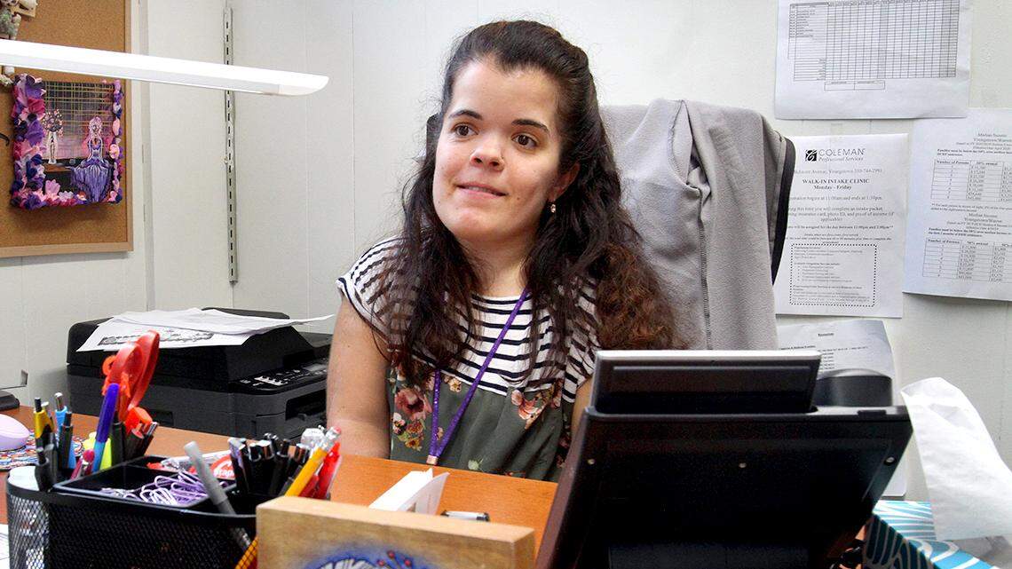 Madison Goske, a licensed social worker who helps the homeless with rapid rehousing, is shown in her office at Catholic Charities’ Voice of Hope Shelter in Youngstown, on April 6, 2022.