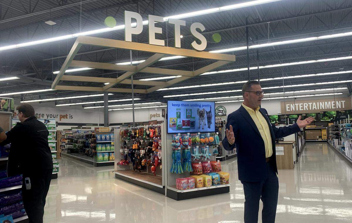 Patrick Hughes led members of the media and city officials through the new 159,000-square-foot supercenter opening at 5800 Mahoning Ave. in Austintown.