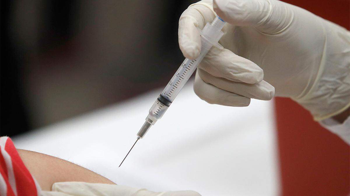 In this Jan. 23, 2020, file photo, a patient receives an influenza vaccine in Mesquite, Texas.
