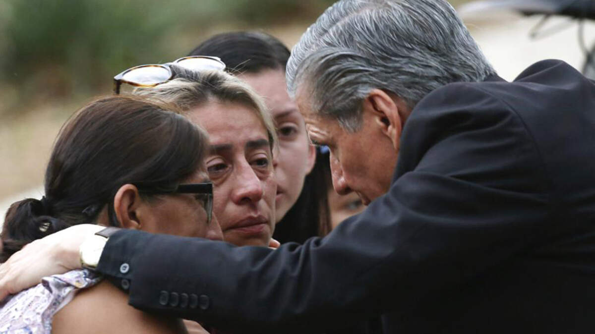The archbishop of San Antonio, Gustavo Garcia-Siller, comforts families outside the Civic Center following a deadly school shooting at Robb Elementary School in Uvalde, Texas, Tuesday, May 24, 2022.