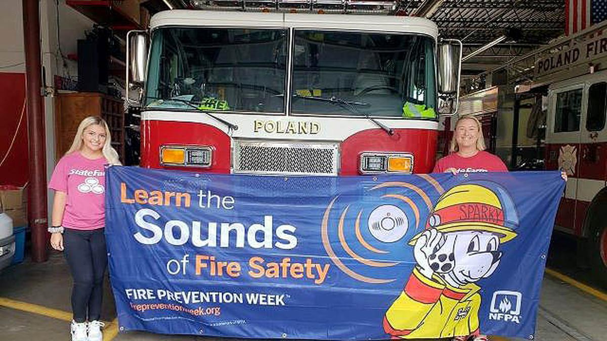 Local State Farm agent Carrie Ratliff, right, and team member Elizabeth Farmer recently visited the Poland Fire Department. Ratliff donated a fire prevention kit to the fire department as part of the Fire Prevention Week campaign. (Contributed photo)