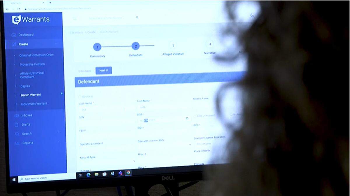 A close-up of a person using Ohio’s new eWarrants electronic criminal database reporting system.