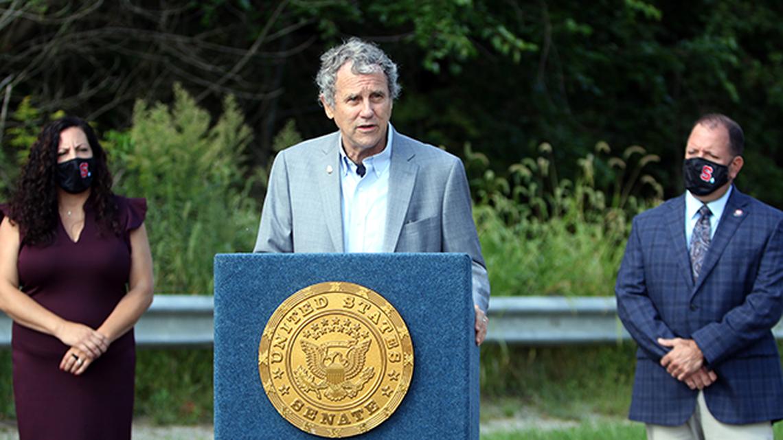 U.S. Sen. Sherrod Brown of Cleveland, D-Ohio, talks about his bridge infrastructure bill, included in a $1 trillion federal infrastructure package, which could fund repairs to aging bridges like Struthers' 100-year-old State Street Bridge, where Brown spoke Thursday, Sept. 9, 2021, alongside Struthers Mayor Catherine Cercone-Miller (left) and Mahoning County Engineer Pat Ginnetti (right).