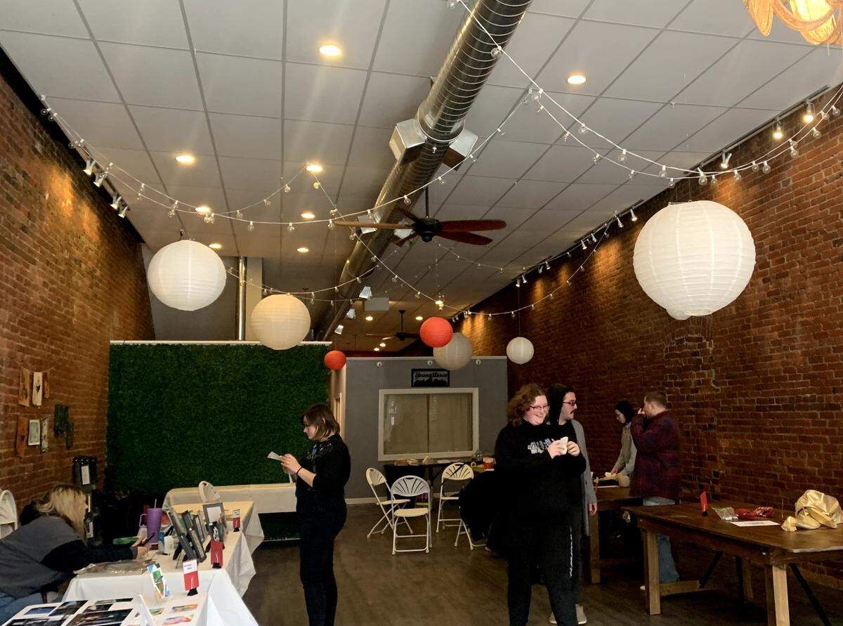 Students and staff setting up for the Youngstown State University Student Holiday Art Show and Market from 4 - 7 p.m. on Dec. 6 at 217 W Federal St. in downtown Youngstown.&nbsp;