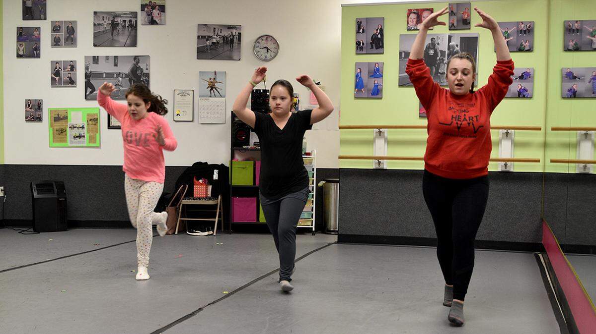 McKenzie Sella, right, dance instructor at Limitless Dance Company, gives a lession at the studio, 5922 Market St., Boardman.