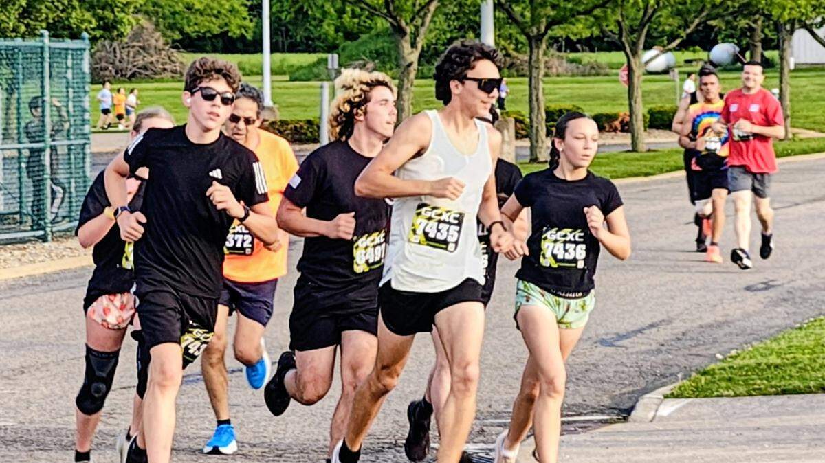 A group of runners race around an early curve in the course during the 19th annual Ryan Johnson Runners Believe Memorial 5K race held Saturday evening in Beloit.