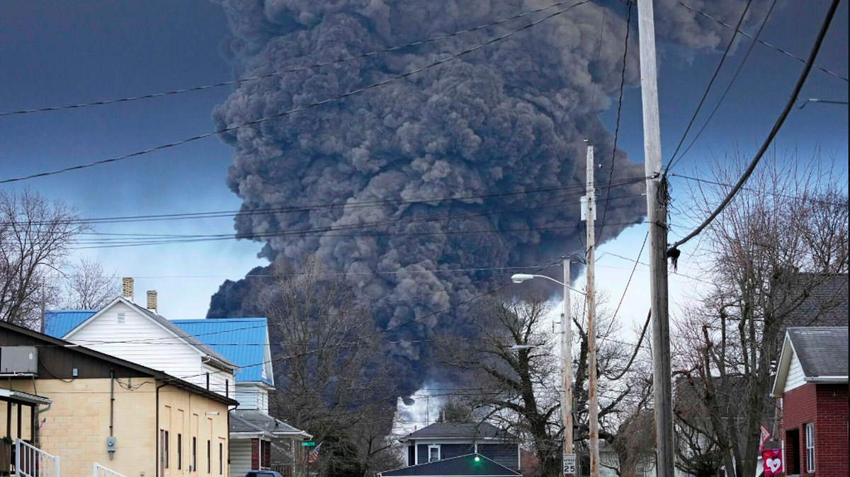 A black plume rises over East Palestine, Ohio on Feb. 6, 2023, as a result of a controlled detonation of a portion of the derailed Norfolk Southern trains.