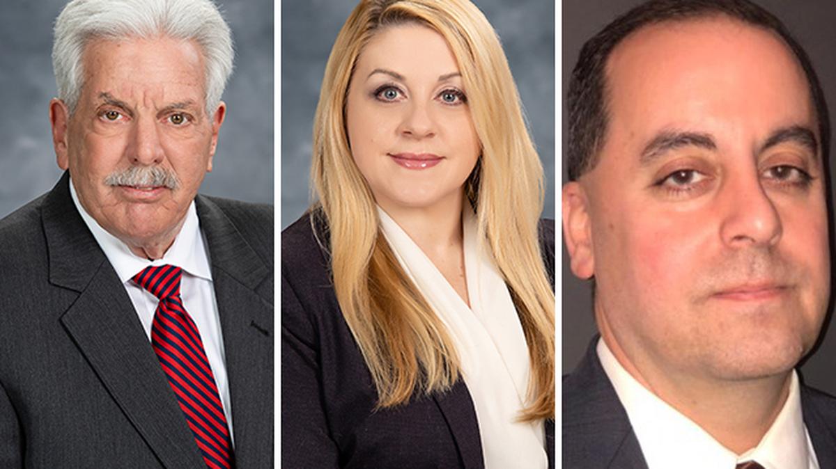 From left to right: Mahoning County Prosecutor Paul Gains and former assistant county prosecutors Dawn Cantalamessa and Martin Desmond