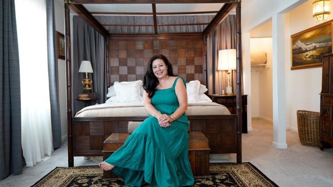 Heather Bise, owner of The House of Bise Bespoke, sits in the "Art" bedroom of her bed-and-breakfast in Cleveland. Small businesses in the U.S. that depend on tourism and vacationers say business is bouncing back. (Tony Dejak | AP Photo)
