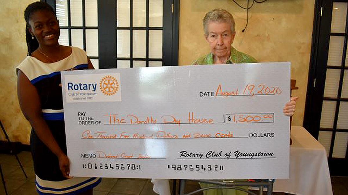 Samantha Turner, left, Rotary Club of Youngstown president, presents a check today to Sister Ann McManamon, Dorothy Day House coordinator. (Contributed photo)