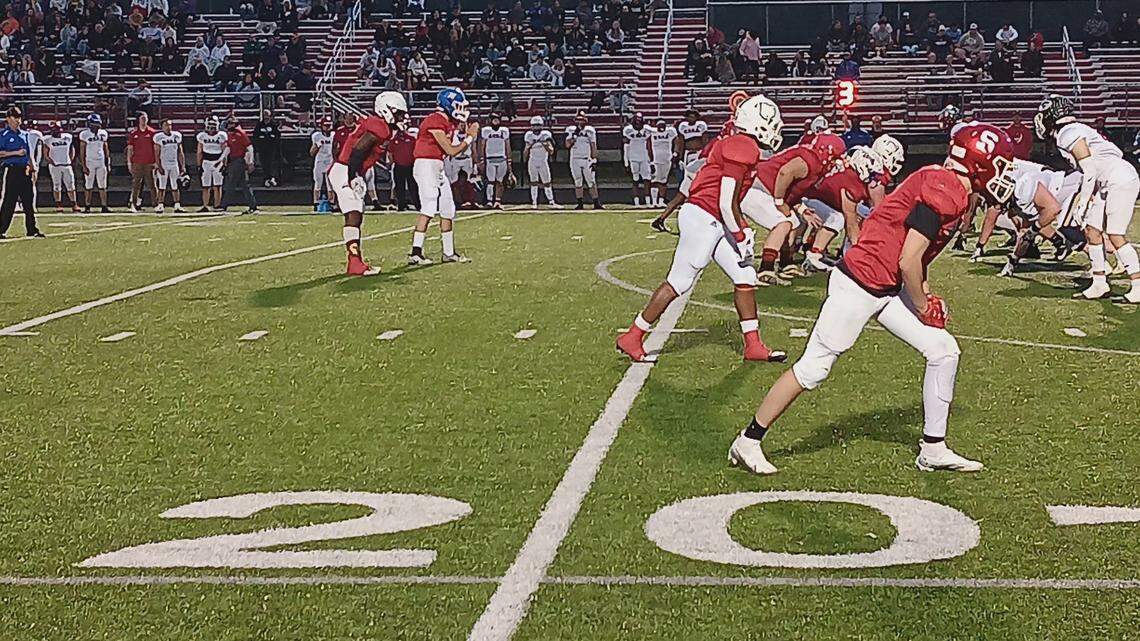 Jackson-Milton quarterback Alex Schiavi, top left center, prepares to take a shotgun snap from center as Alec Grzyb of Struthers, bottom right, who was named MVP of the game, gets set at the line of scrimmage during the 37th annual Jack Arvin All-Star Classic football game Thursday night in Canfield.