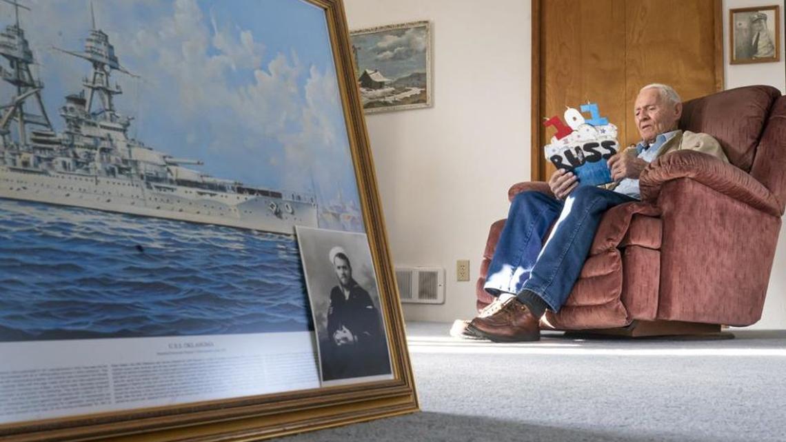 Pearl Harbor survivor and World War II Navy veteran David Russell, 101, reads a birthday card while talking about his time aboard the USS Oklahoma and his life after the war on Nov. 22, 2021, in Albany, Ore. (Nathan Howard | AP Photo)