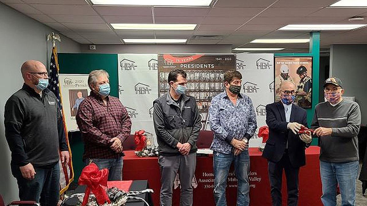 Past presidents of the Home Builders & Remodelers Association of the Valley pass the gavel to 2021 President Steve Brewer. From left are Brewer; Mark Ramunno, 2020 president; Rich Abel, 2017 president; Sam Boak, 2012 president; Jim Grantz, 2006 president; and Richard Yannone, 2003 president. (Contributed photo)