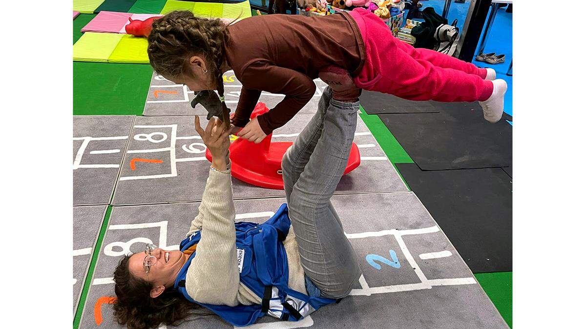 Joanna Zeiger-Guerra of educational agency Dror Israel (below) was one of several Israeli educators who traveled to Russia-Ukraine war refugee centers in Poland, where they helped more than 600 children each day feel some sense of normalcy.