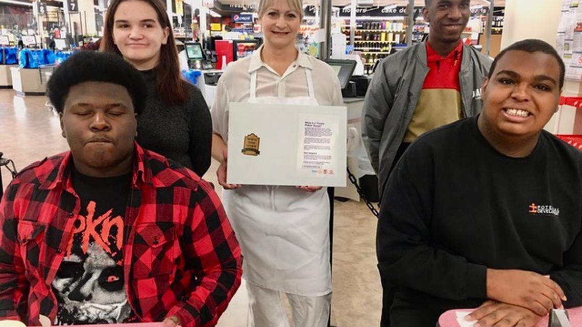 Students participate in first project, Purple Pinkie Donut Project (back row): Mary Jane Dunning, Struthers IGA Bakery Manager Sue Runion, and Jaylon Dent (front row); Amir McNeil and Preston Frost