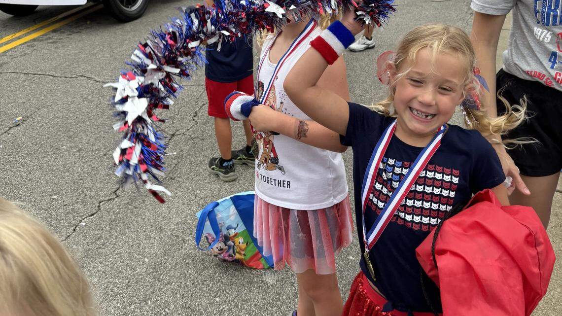 Nora and Clara Koenig enjoy the Canfield Fourth of July parade on Thursday.