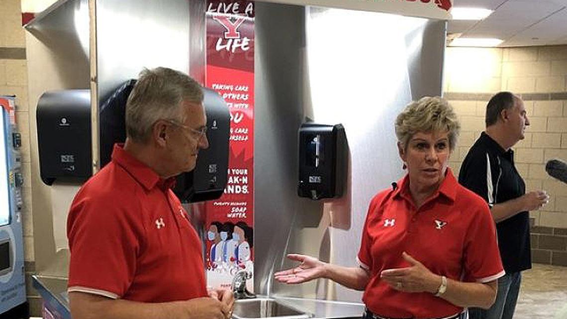 Youngstown State University President Jim Tressel and his wife, Ellen, are seen near one of the new handwashing stations at YSU. (Photo courtesy of YSU)