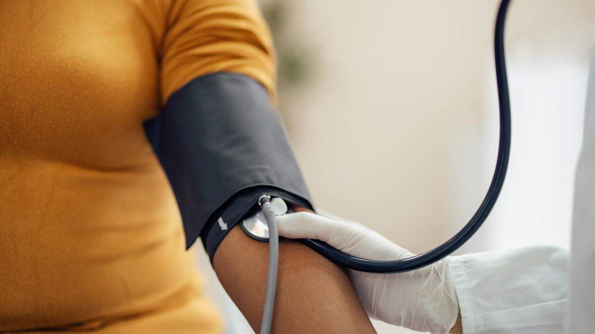 A patient is tested for high blood pressure.