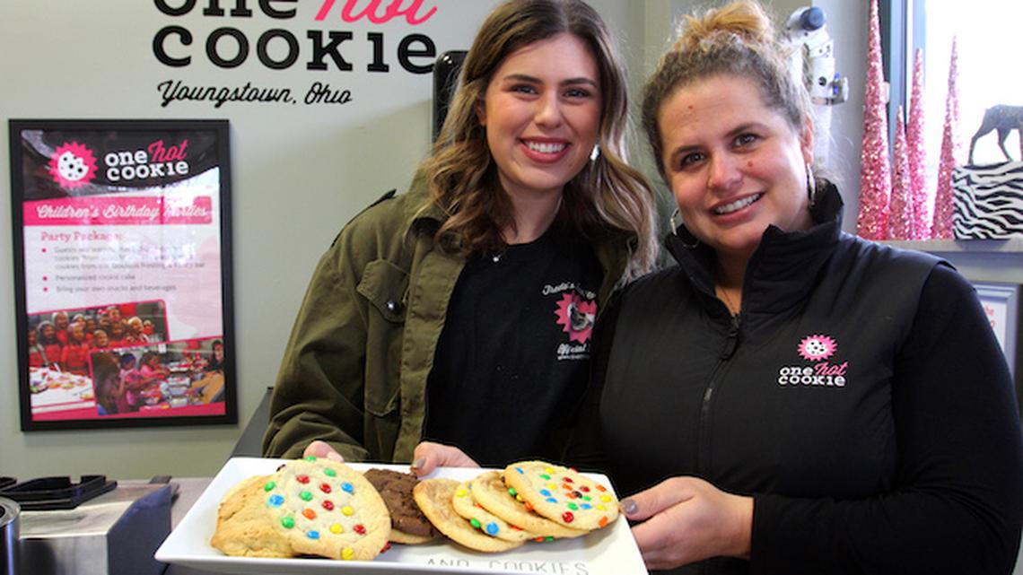 Morgen Chretien, left, and her mother Bergen Giordani own and operate One Hot Cookie. The pair opened the business in 2013 in Youngstown and have locations in two states. They are shown in the downtown Youngstown location. (William D. Lewis)