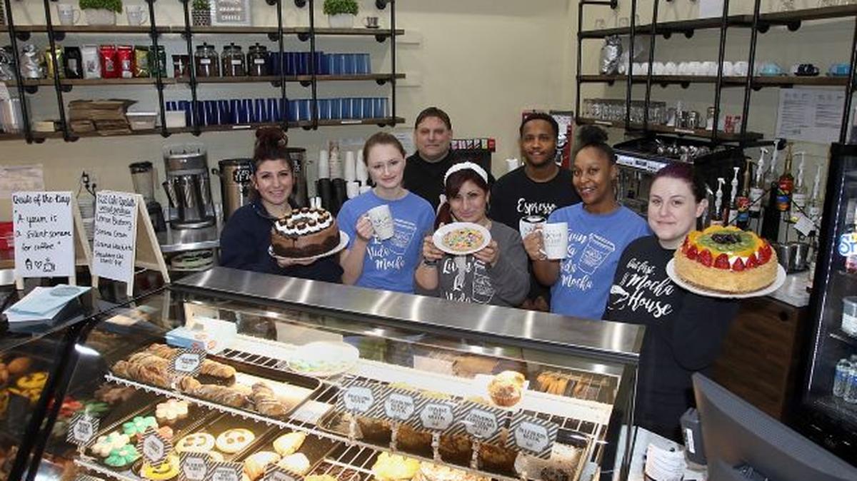Staff members at Mocha House’s new location in downtown Youngstown are, front row from left, Kalli Georgalos, Brilynn Crisp, Christina Vornas, Cierra Mann and Megan Gimmarco; and back row from left, Nick Likaris and Earl Marlowe. (Photo by Robert K. Yosay)