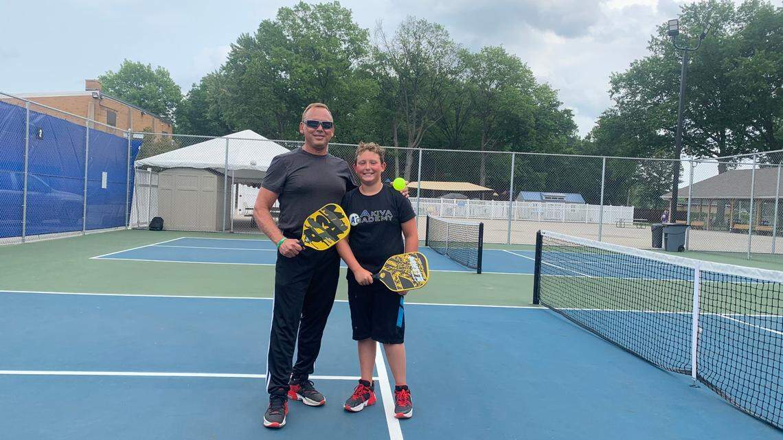 Joshua Martin and his dad, Ron Martin, play as a team at the JCC pickleball court