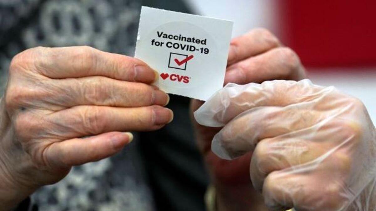A patient receives a sticker after receiving the Moderna COVID-19 vaccine at a CVS Pharmacy branch in Los Angeles on March 1. (Marcio Jose Sanchez | AP Photo, File)