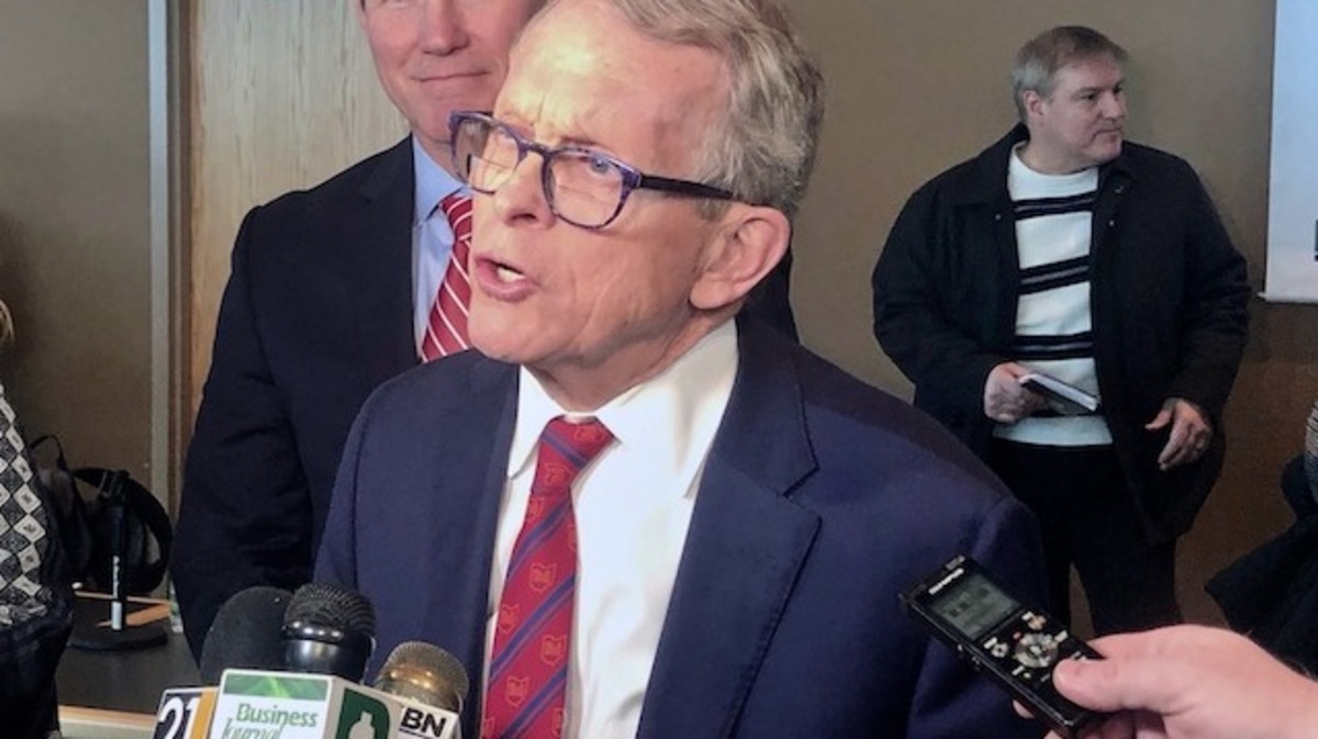 Gov. Mike DeWine, flanked by Lt. Gov. Jon Husted, meets the Valley media to discuss the coming electric vehicle industry.