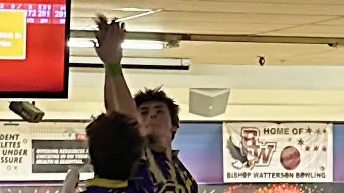 Warren Champion bowlers Aidan LePosa and Alan Derry celebrating Aidan’s strike in a semi-final Baker’s match. 