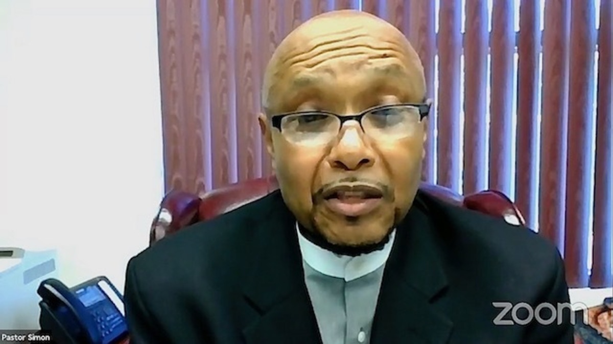 The Rev. Kenneth Simon started the Next Steps Coalition town hall with a prayer on Tuesday evening. 