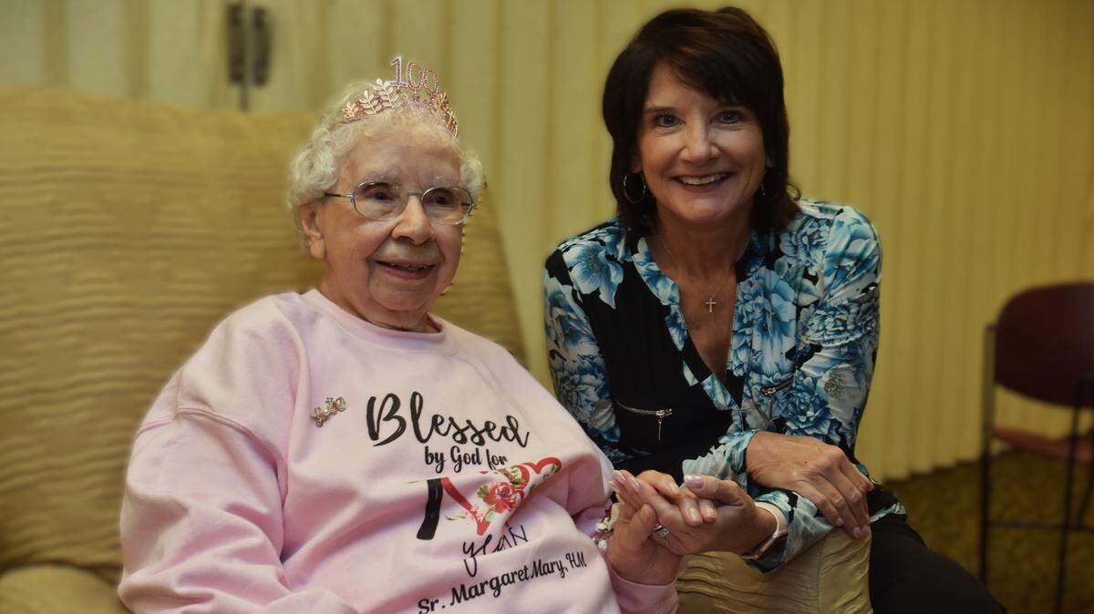 Sister Margaret Mary Siegfried spends her 100th birthday with friends like CEO Kathy Harley at St. Elizabeth Youngstown Hospital