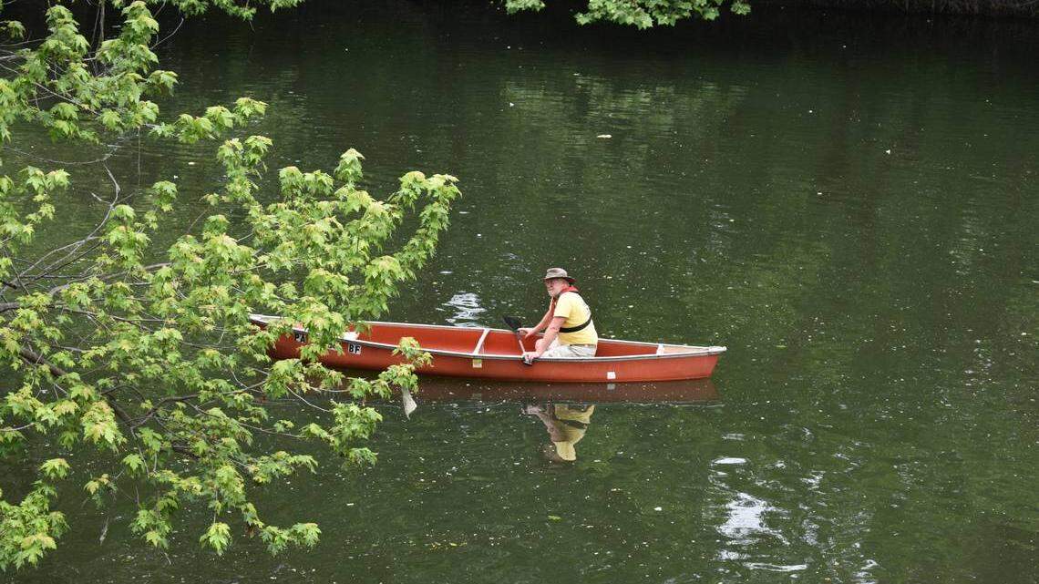 A canoe rider takes part in Riverfest at the Mahoning River