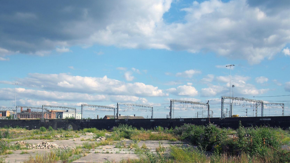 A large unused urban brownfield site is awaiting development.