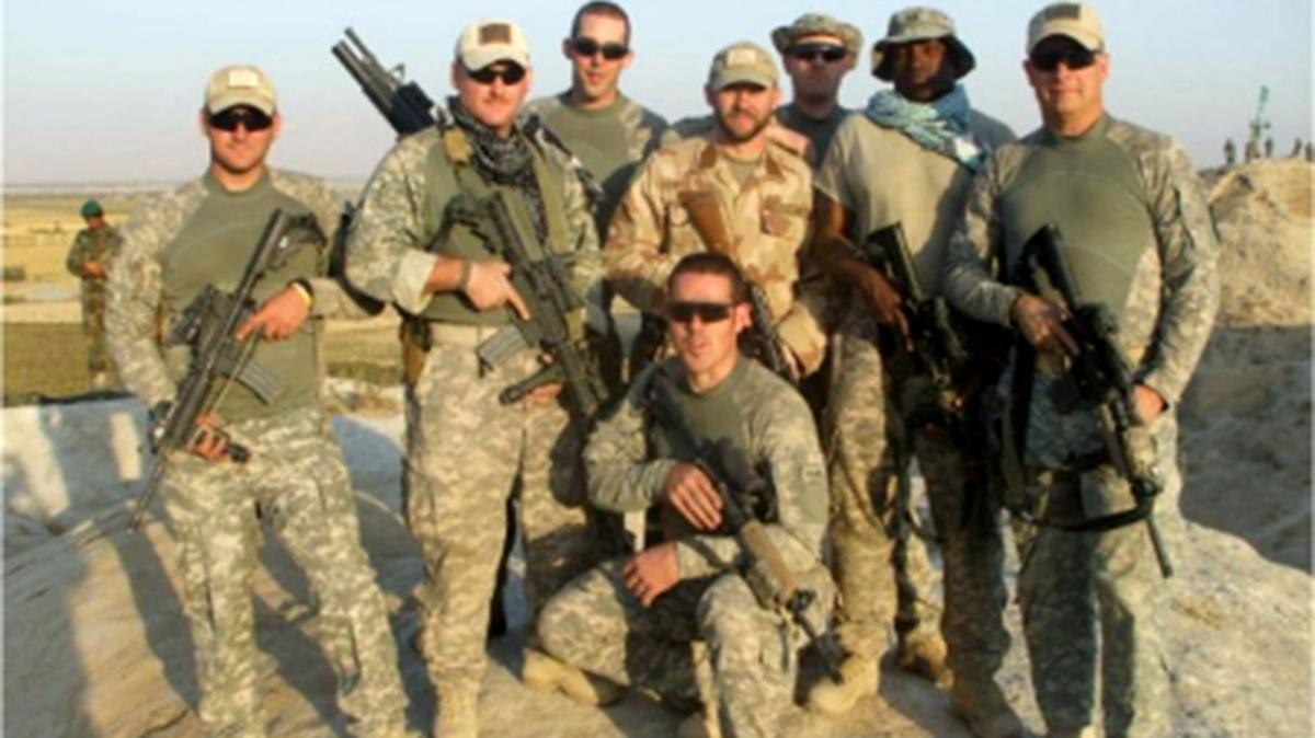 Rick Stockburger (standing in the rear with no hat) poses with other U.S. soldiers in Baghlan Province, Afghanistan, north of Kabul, in 2009.