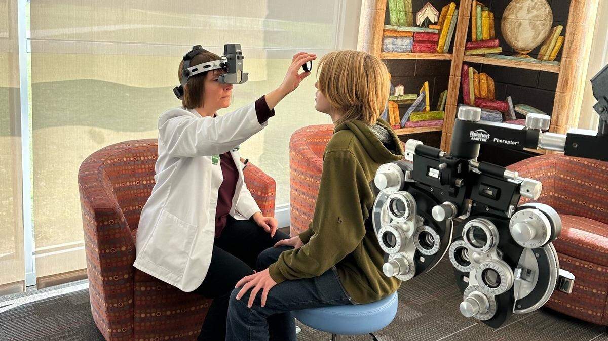 A student receiving an eye exam at Northwestern Local Schools in Springfield through an iSee clinic. 