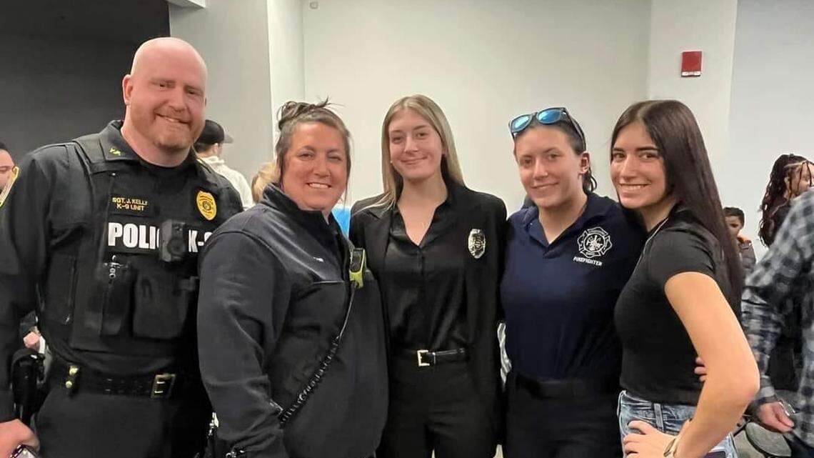 Captain Courtney Kelly, recipient of the 2024 Ohio Fire Service Instructor of the Year award with family members who are also in public service.