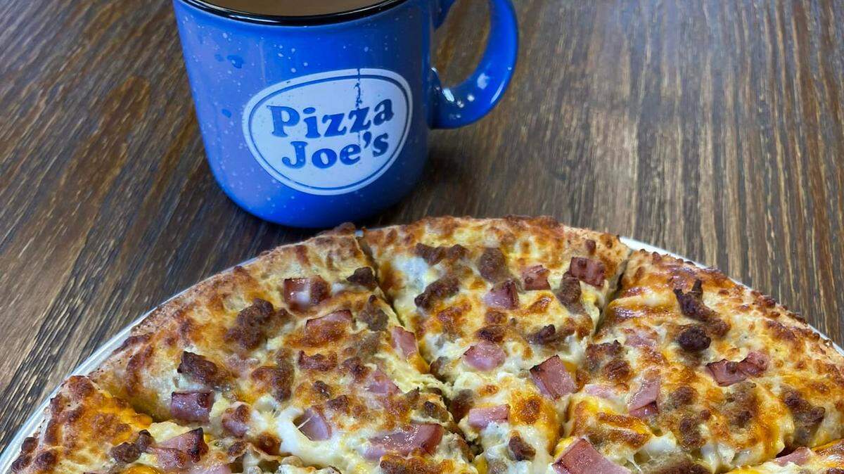 Breakfast pizza and mug; Pizza makers from the New Castle, Penn. Pizza Joe’s location will be competing in the International Pizza Expo in Las Vegas.