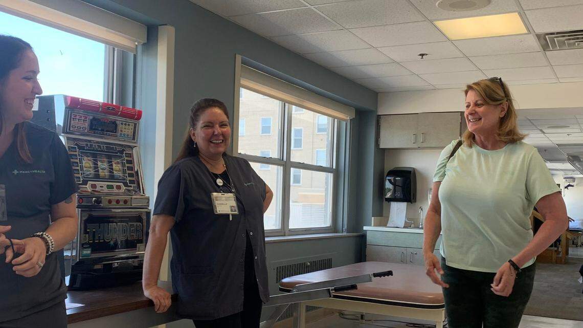 (left to right) Occupational therapists Stacy DeSarro and Danielle Meyer catch up with Tracy Polak, stroke survivor from Poland Township.