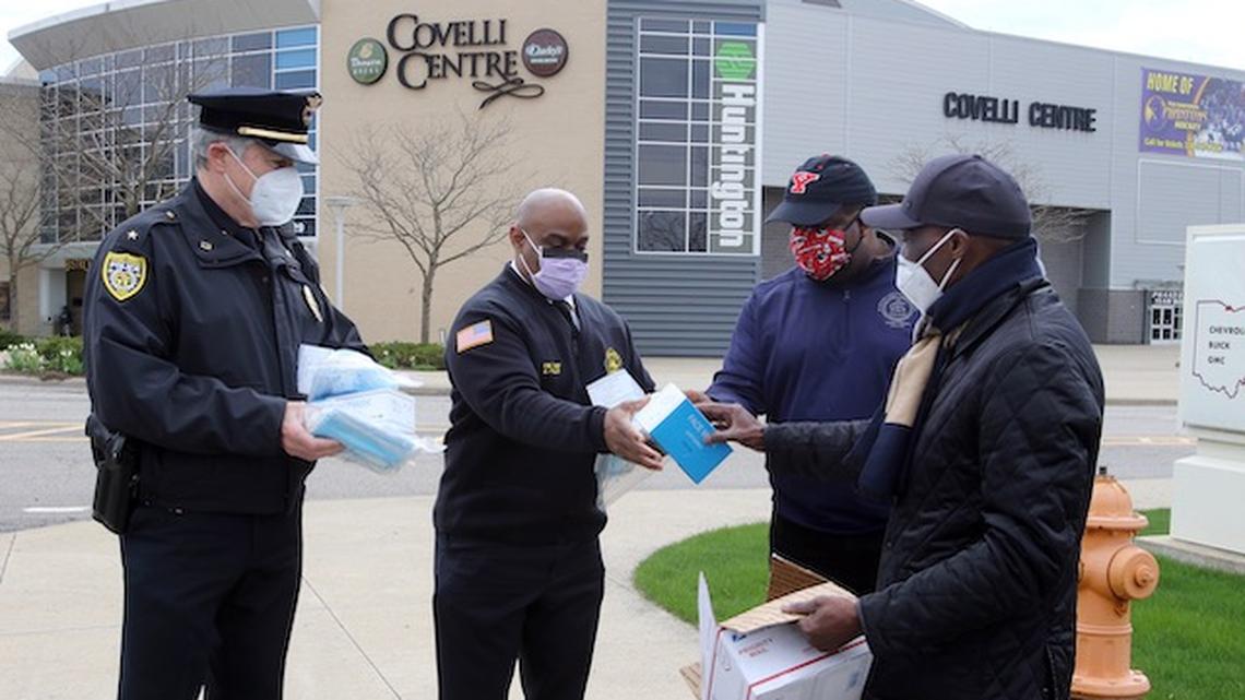 Herb Washington donated surgical and medical masks to Youngstown to distribute to police and fire departments and City Hall. Police Chief Robin Lees, Fire Chief Barry Finley, Mayor Jamael Tito Brown met with Washington at the Covelli Centre to accept them. (Bob Yosay/Mahoning Matter)