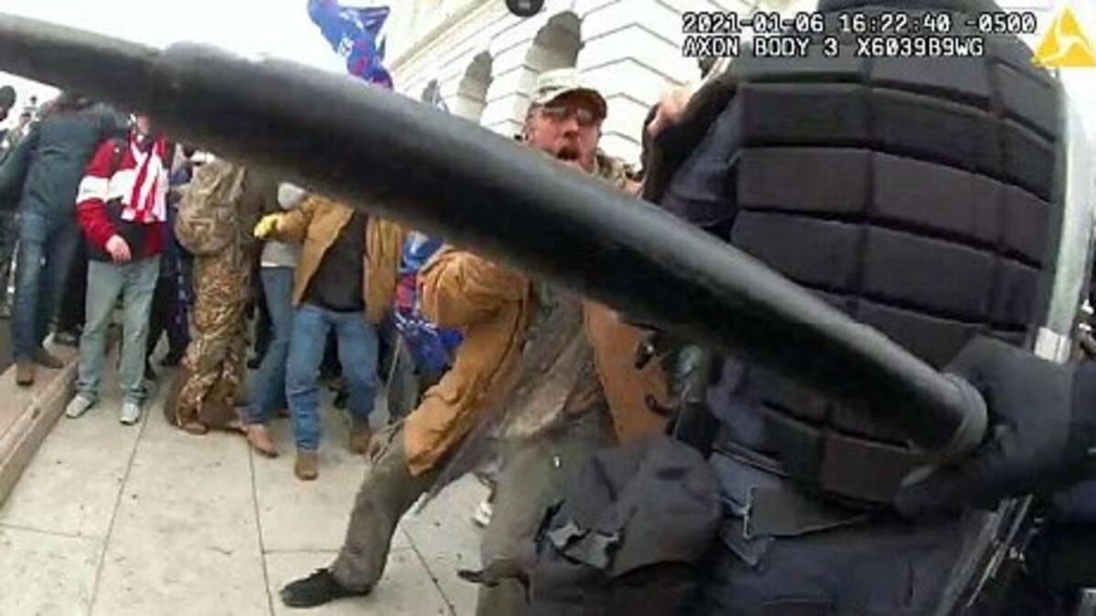 Kenneth Joseph Owen Thomas (face visible), an East Liverpool man charged in the Jan. 6 attack on the U.S. Capitol, appears in police body camera footage taken during the riot.