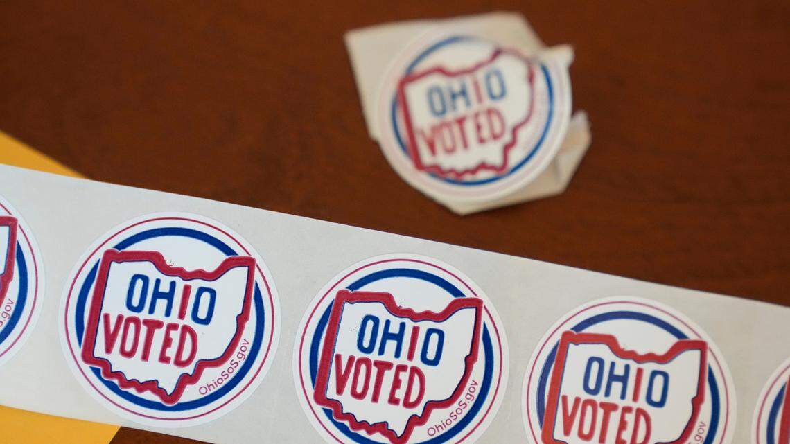 “Ohio Voted” stickers await voters after they cast their ballots at the Meadowbook Golf Club in Clayton, Ohio Tuesday, Nov. 8, 2022. (AP Photo/Michael Conroy)