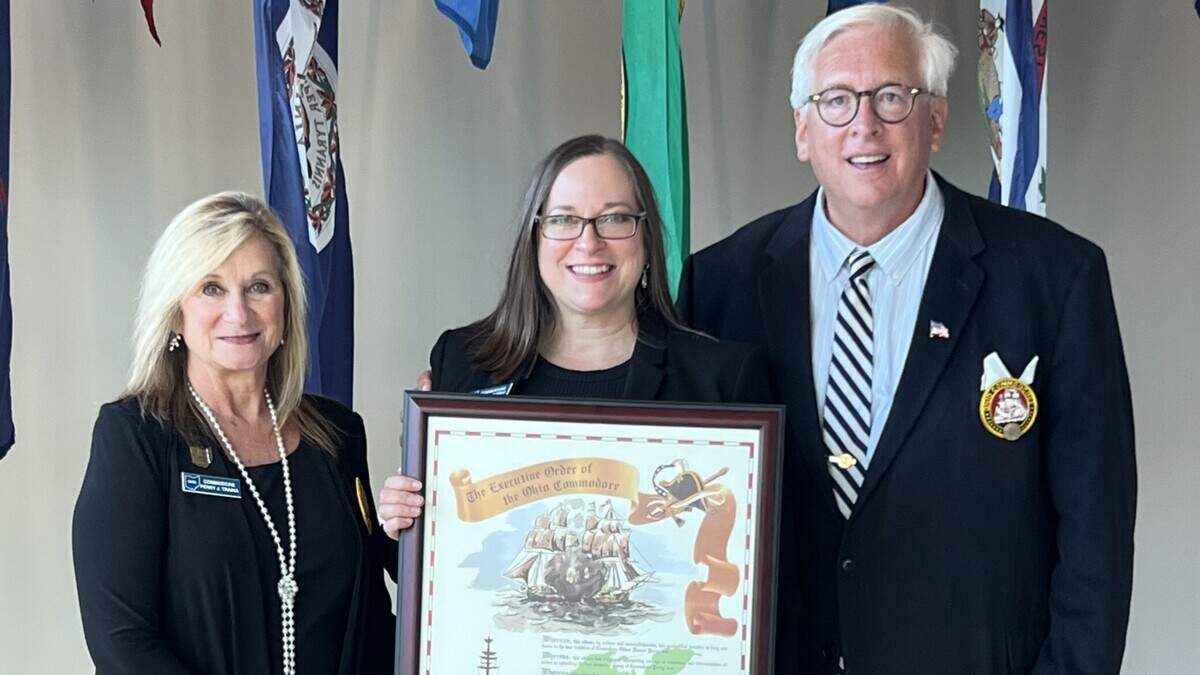Sarah Boyarko (center), Vice President of Economic Development for Lake to River, was recently inducted into the Association of Ohio Commodores.