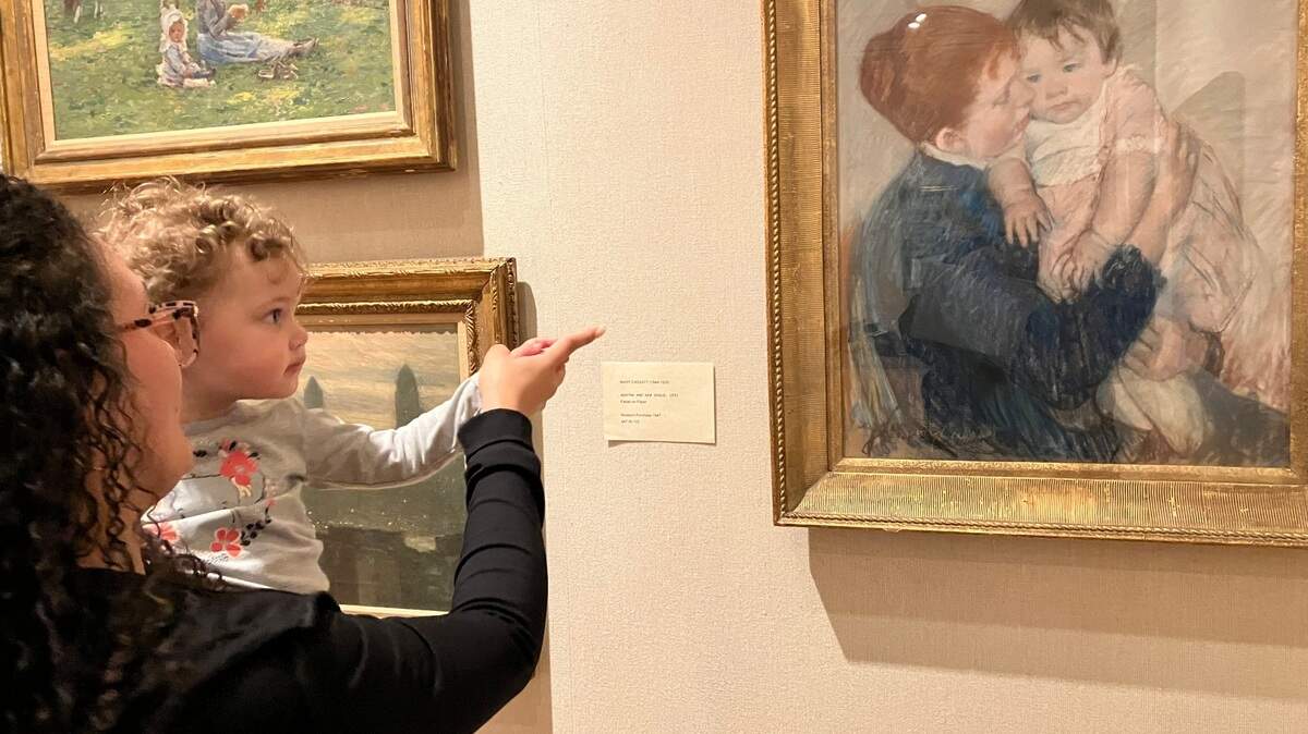 Alexis Perez of Boardman and her daughter, Nova, 1, look at a painting Thursday at The Butler Institute of American Art.