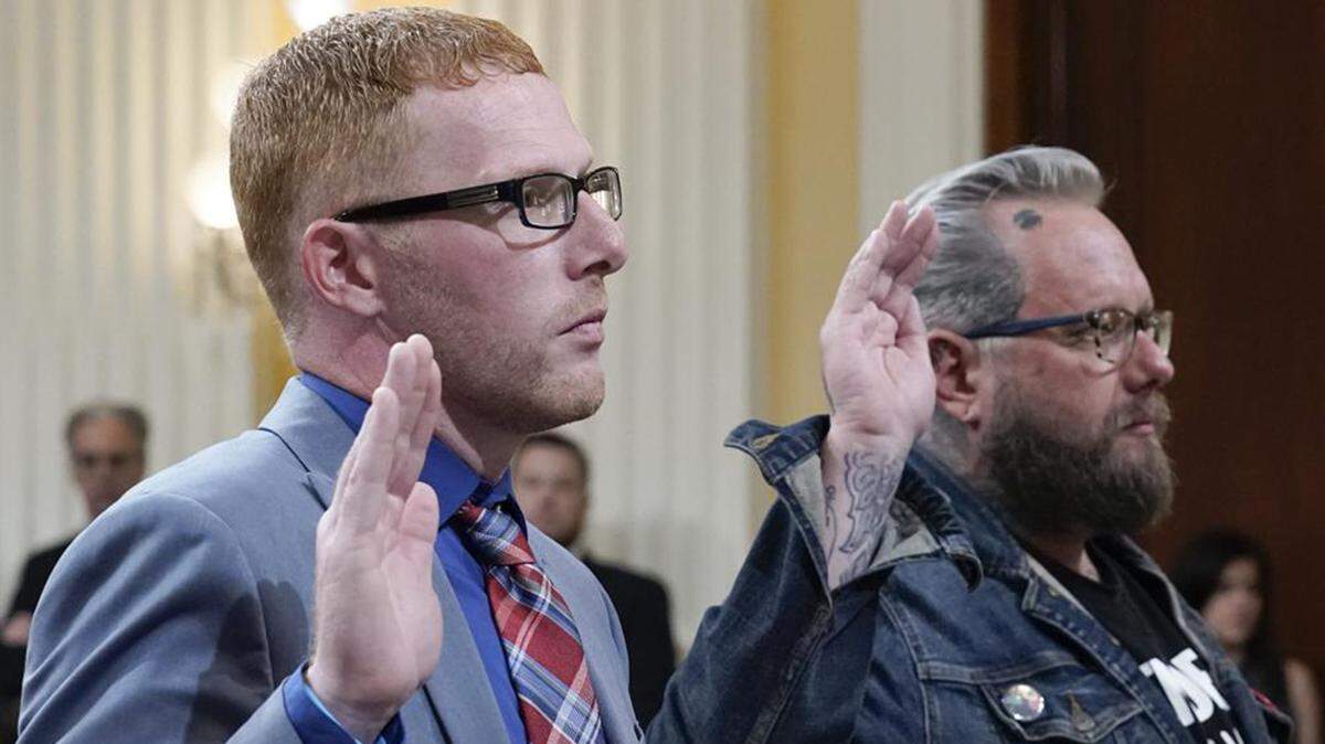 Stephen Ayres, who pleaded guilty in June 2022 to disorderly and disruptive conduct in a restricted building, left, and Jason Van Tatenhove, an ally of Oath Keepers leader Stewart Rhodes, right, are sworn in to testify as the House select committee investigating the Jan. 6 attack on the U.S. Capitol holds a hearing at the Capitol in Washington, Tuesday, July 12, 2022.