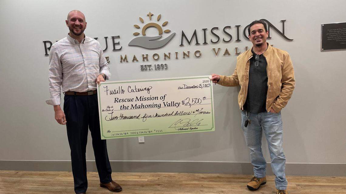 President and CEO of Rescue Mission of Mahoning Valley John Muckridge III with Mark Fusillo, owner and certified executive chef at Fusillo Catering, Inc.