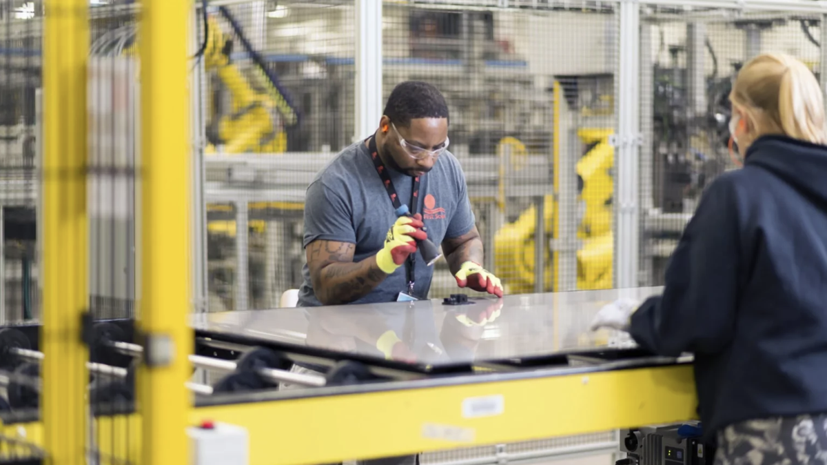 Crew members perform an inspection at one of First Solar’s Ohio manufacturing plants.