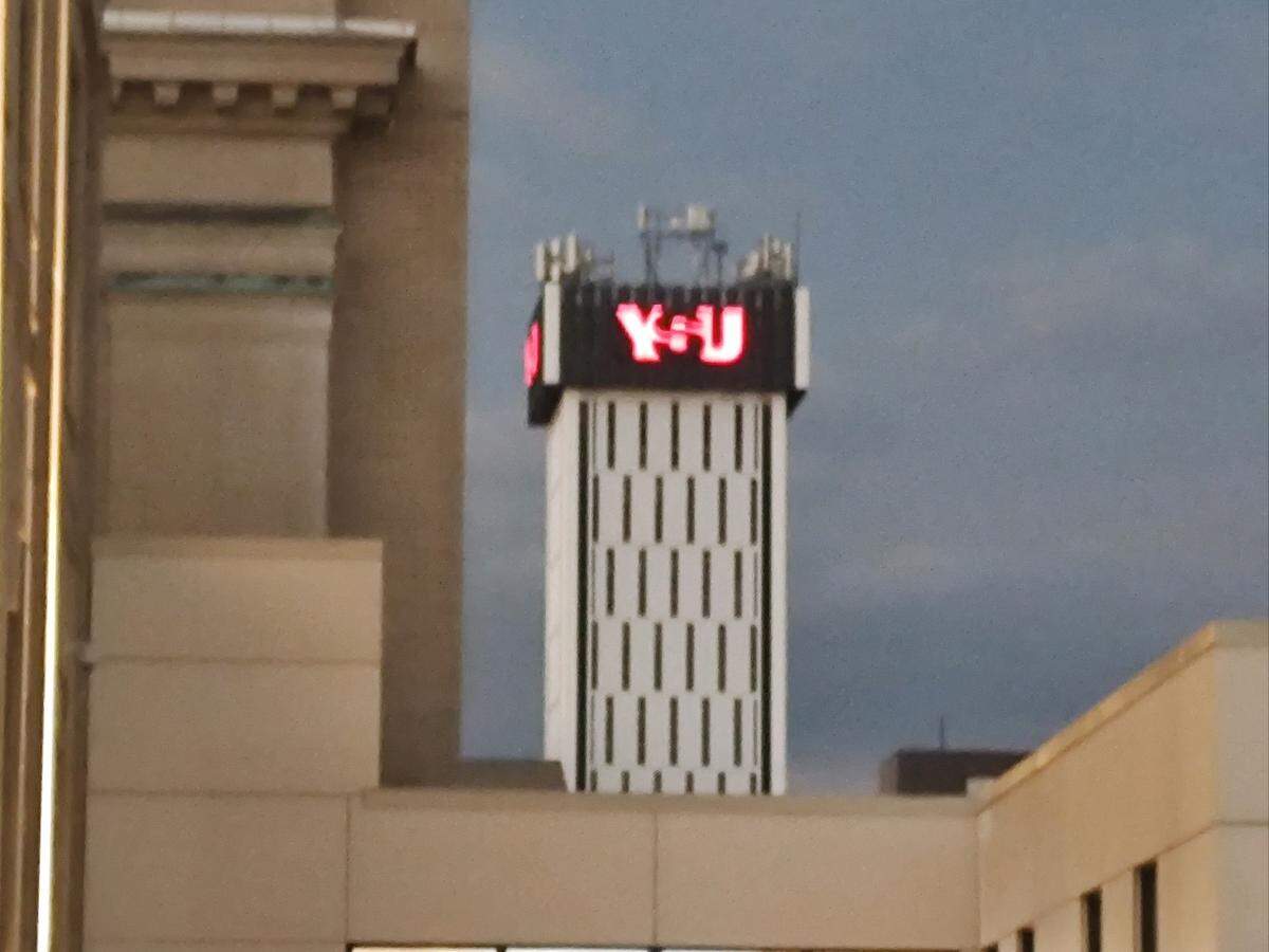 A Youngstown State University lights up during the day after darkness rolls in during the solar eclipse.